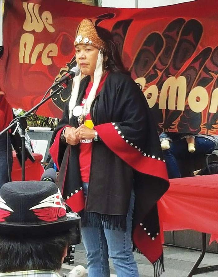 Sweetwater Nannauck from the Tlingit, Haida, and Tsimshian tribes of southeast Alaska and Director of Idle No More Washington speaks at the Indigenous People’s Day celebration at Westlake Center. Photo/Kim Kalliber